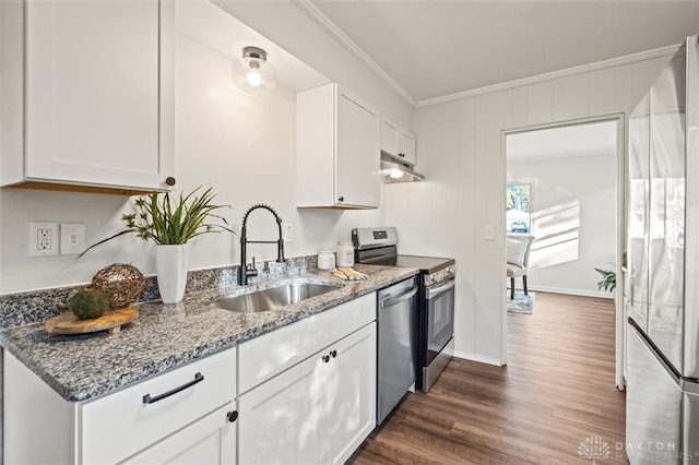 kitchen with stainless steel appliances, ornamental molding, sink, white cabinetry, and light stone counters