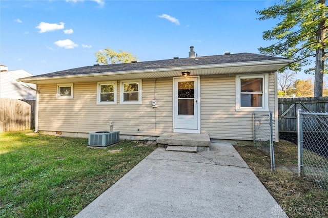 bungalow with central AC and a front yard