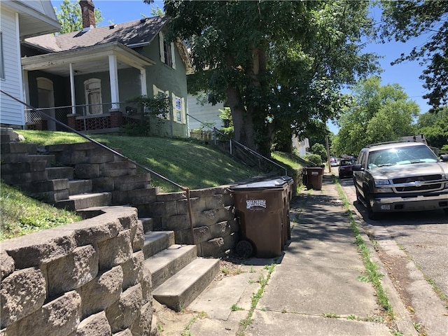 view of home's exterior with a lawn