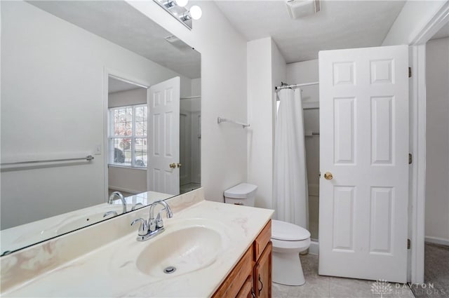 bathroom with walk in shower, vanity, toilet, and tile patterned floors