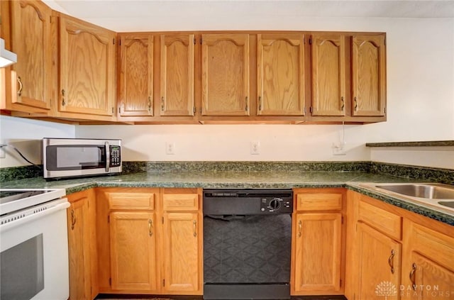 kitchen featuring black dishwasher and white range