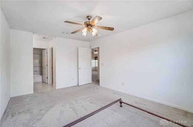 unfurnished bedroom with light colored carpet and ceiling fan