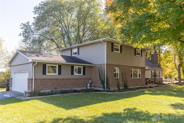 view of front of home featuring a front yard and a garage