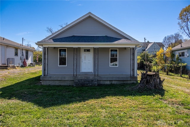 view of front of home with a front yard and a porch