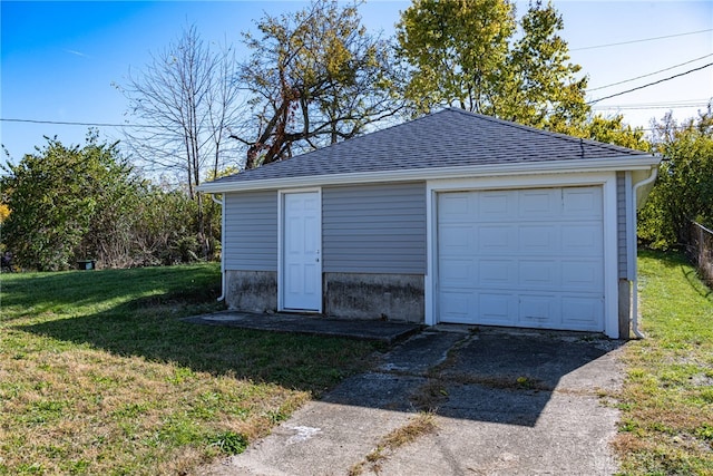 garage with a yard