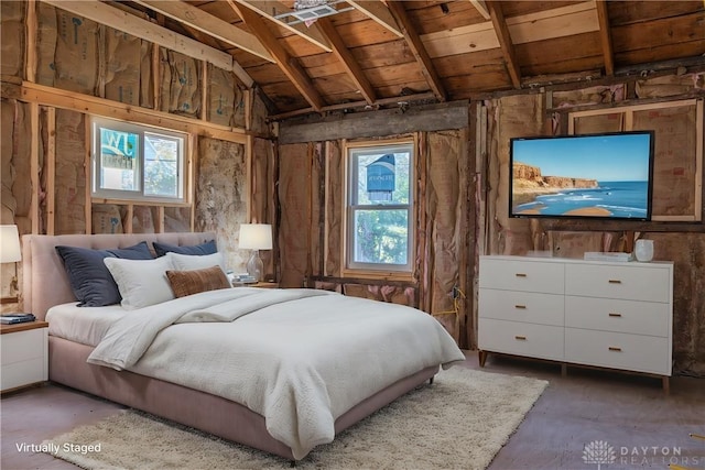 bedroom with lofted ceiling