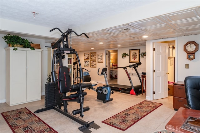 exercise area with light tile patterned floors