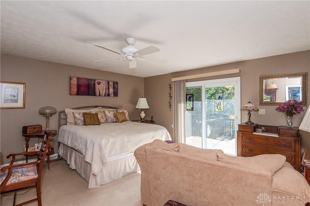 bedroom featuring access to outside, light colored carpet, and ceiling fan