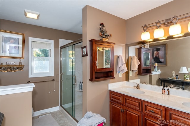 bathroom featuring vanity and walk in shower