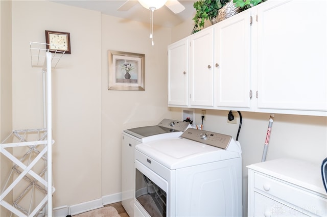 clothes washing area featuring ceiling fan, separate washer and dryer, and cabinets