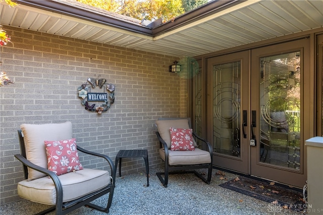 view of exterior entry featuring french doors