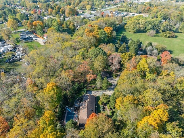 birds eye view of property with a view of trees