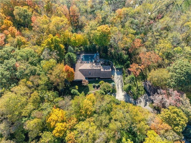 bird's eye view featuring a forest view