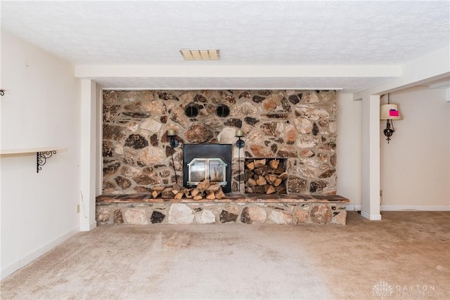 unfurnished living room with carpet floors, visible vents, and a textured ceiling