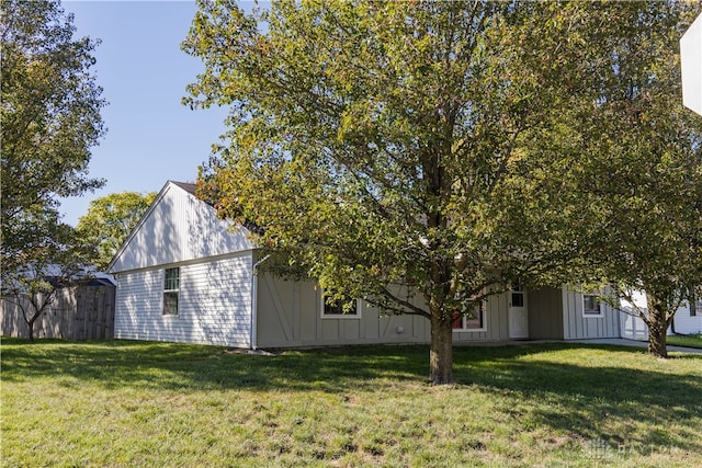 view of home's exterior featuring a yard