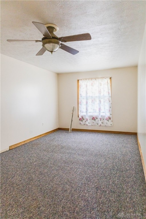 carpeted empty room with a textured ceiling and ceiling fan