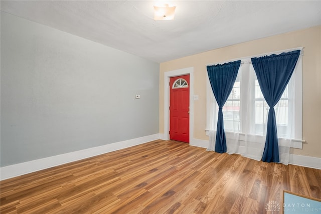 unfurnished room featuring hardwood / wood-style floors