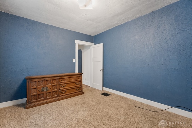 unfurnished bedroom featuring carpet