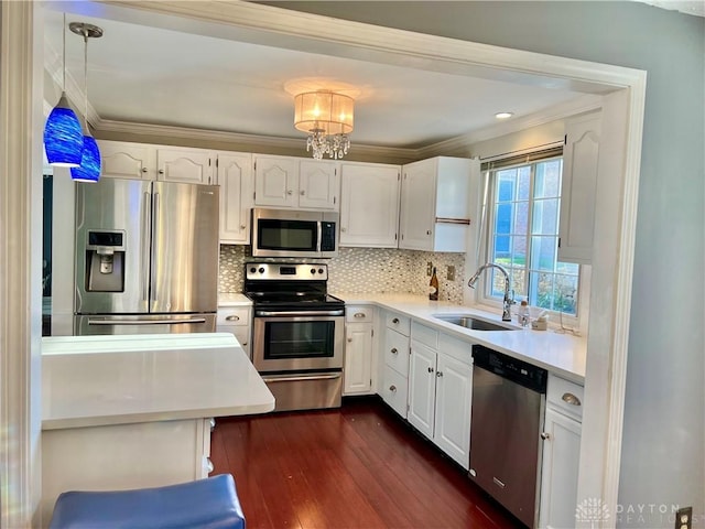 5 Devon Ct, Fairfield, OH 45014 - kitchen with appliances with stainless steel finishes, a sink, ornamental molding, dark wood-style flooring, and white cabinets