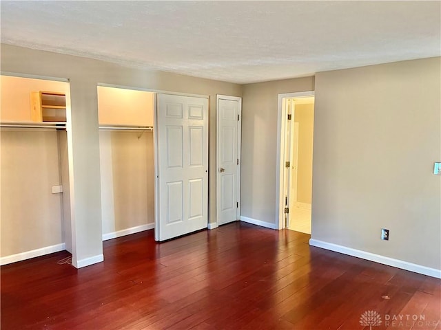 5 Devon Ct, Fairfield, OH 45014 - unfurnished bedroom with two closets, hardwood / wood-style flooring, and baseboards