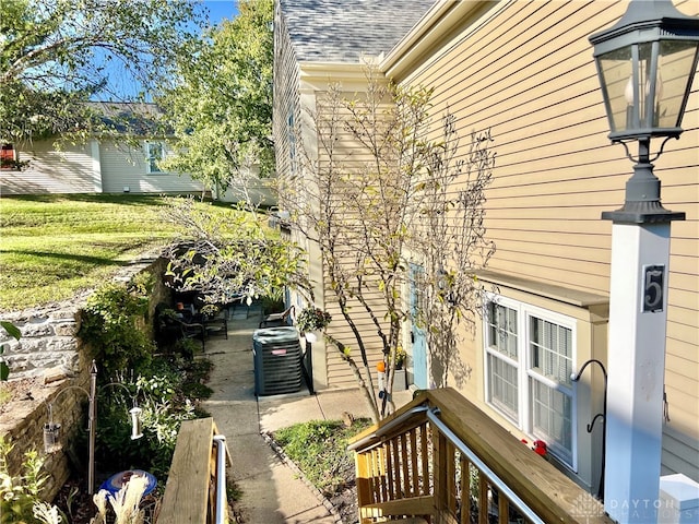 view of home's exterior with central AC unit