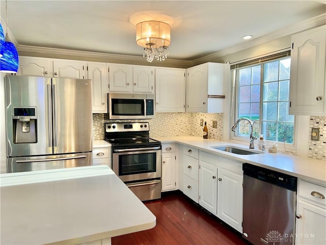 5 Devon Ct, Fairfield, OH 45014 - kitchen featuring stainless steel appliances, a sink, dark wood-style floors, white cabinets, and crown molding