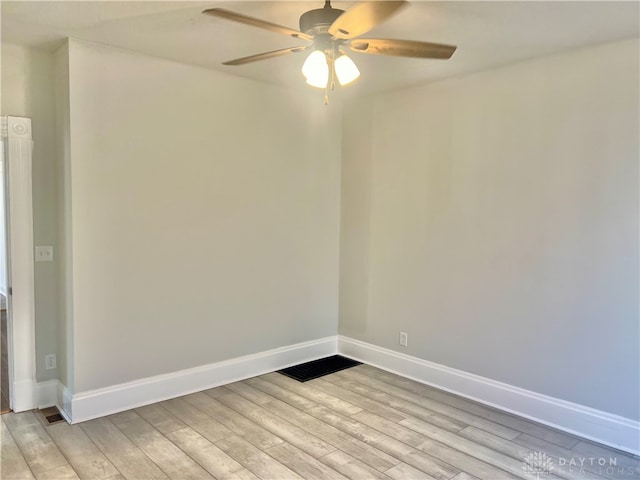 empty room featuring ceiling fan and light hardwood / wood-style flooring