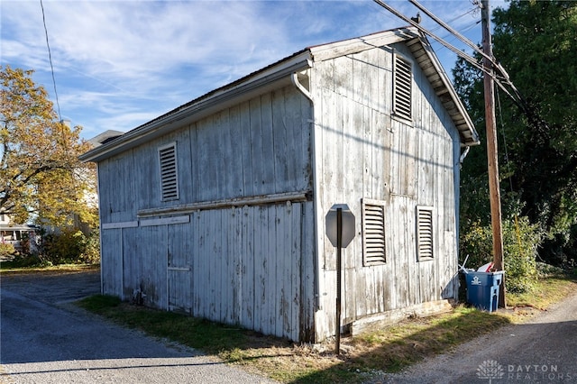 view of property exterior featuring an outdoor structure