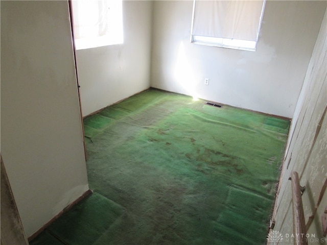 unfurnished room with carpet floors