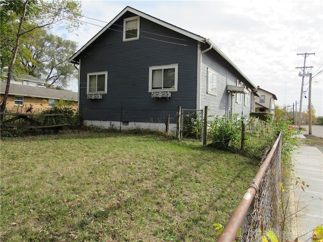 view of home's exterior featuring a lawn