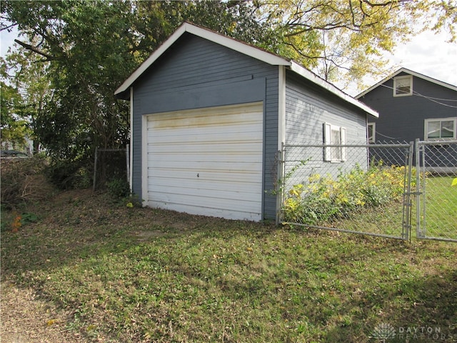 garage featuring a lawn