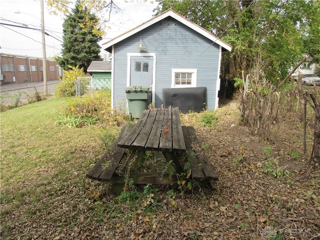 back of property featuring a lawn