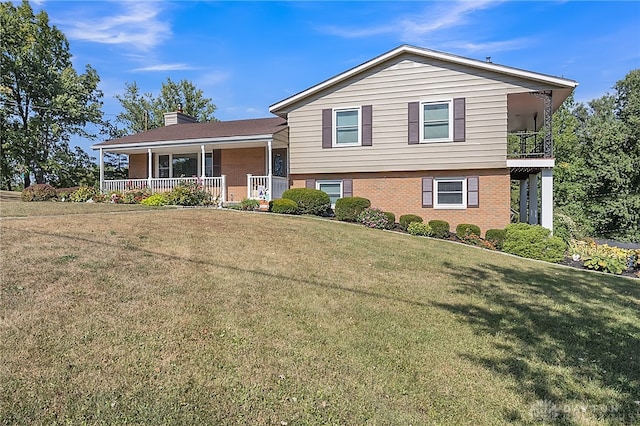 split level home featuring a front yard and a porch