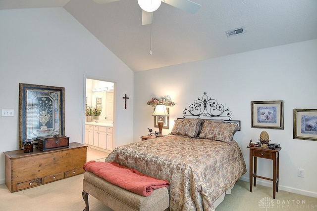 bedroom with ensuite bath, light carpet, high vaulted ceiling, and ceiling fan