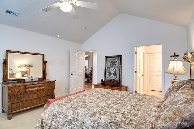 carpeted bedroom featuring vaulted ceiling and ceiling fan