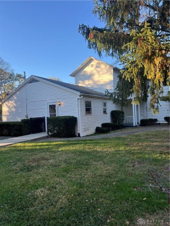 view of home's exterior featuring a lawn