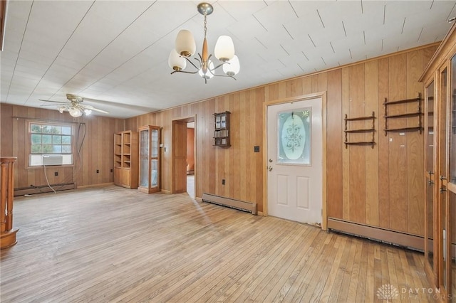 entryway with baseboard heating, ceiling fan with notable chandelier, and light hardwood / wood-style flooring