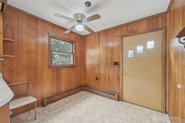 entryway with wooden walls, ceiling fan, and baseboard heating