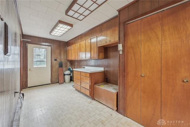 kitchen featuring wooden walls