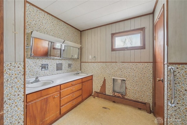 bathroom featuring ornamental molding and vanity