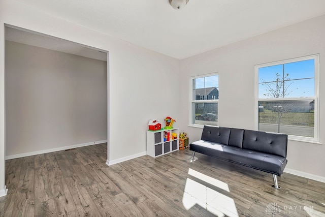 living area with hardwood / wood-style flooring