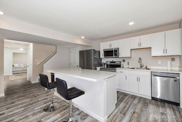 kitchen featuring sink, appliances with stainless steel finishes, and white cabinets