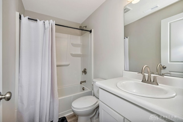 full bathroom featuring vanity, shower / bath combo with shower curtain, toilet, and wood-type flooring