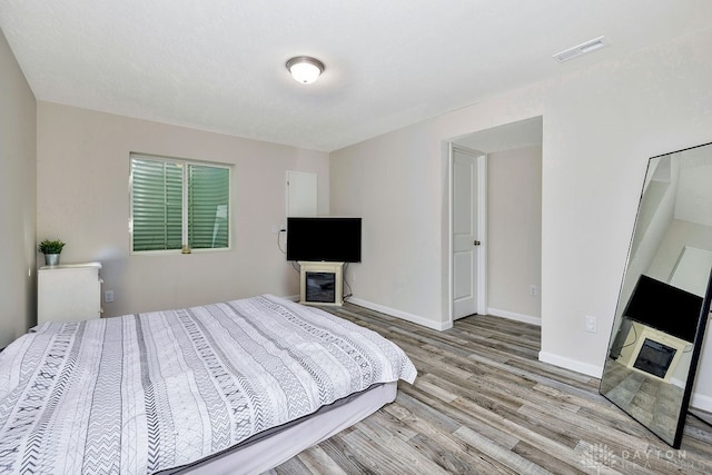 bedroom featuring light hardwood / wood-style floors