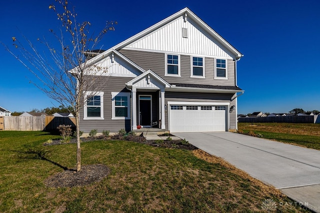 view of front of home featuring a garage and a front lawn