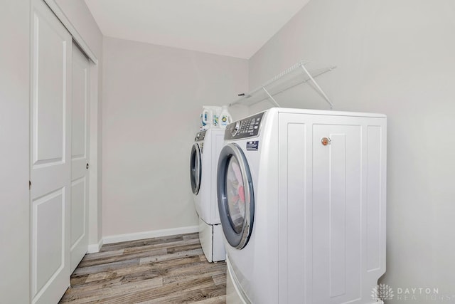 washroom featuring light hardwood / wood-style flooring and independent washer and dryer