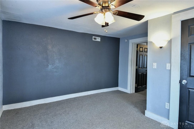 unfurnished room with ceiling fan and carpet flooring