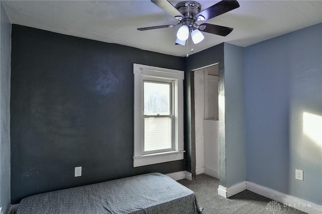 unfurnished bedroom with ceiling fan and carpet floors