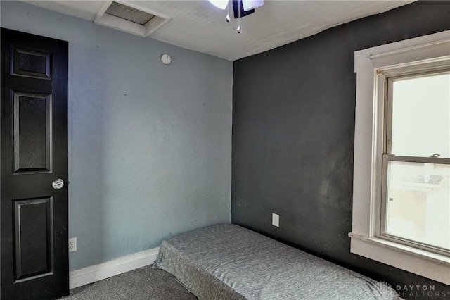 bedroom featuring ceiling fan, carpet flooring, and multiple windows