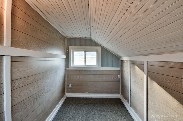 bonus room with wood ceiling, carpet flooring, lofted ceiling, and wooden walls